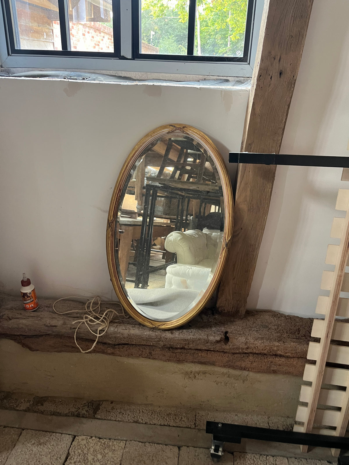 Oval Gilt-Framed Wall Mirror